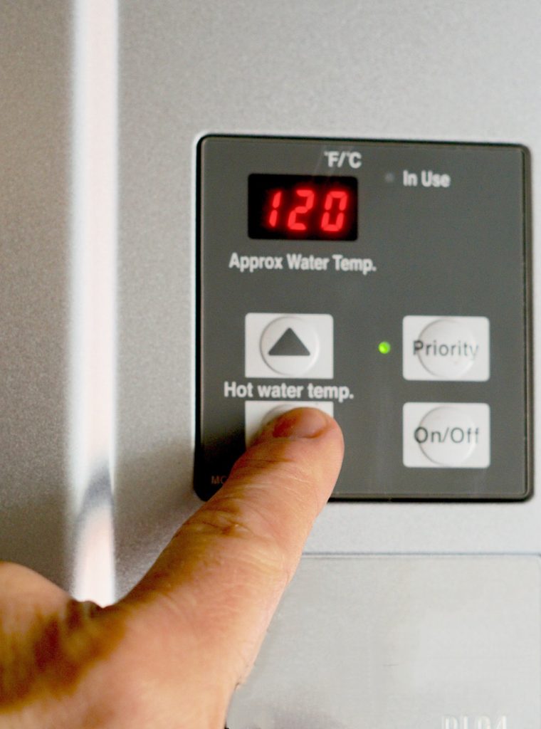 Finger on hot water heater control unit